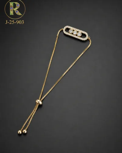 Celebrate the cherished bond of love and protection this Raksha Bandhan with our elegant Gold-Tone CZ Stone Rakhi Bracelet. Featuring a sophisticated oval design adorned with sparkling cubic zirconia stones, this bracelet beautifully blends traditional sentiment with modern style. Its sleek and premium look makes it a meaningful gift that your sister can treasure long after the festival is over.